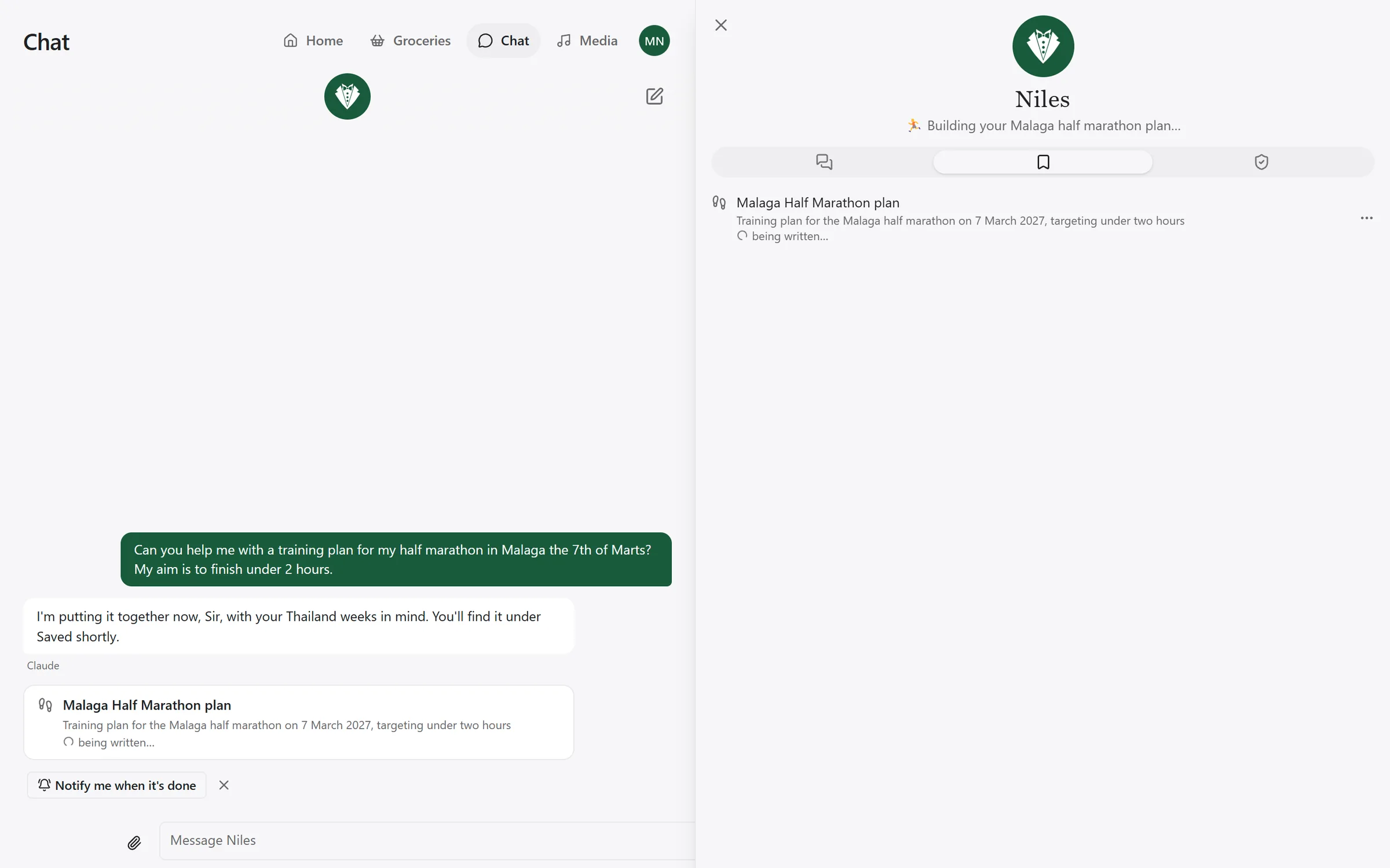 The chat beside Niles's panel, open on Saved, where a training plan is listed while it is being written.